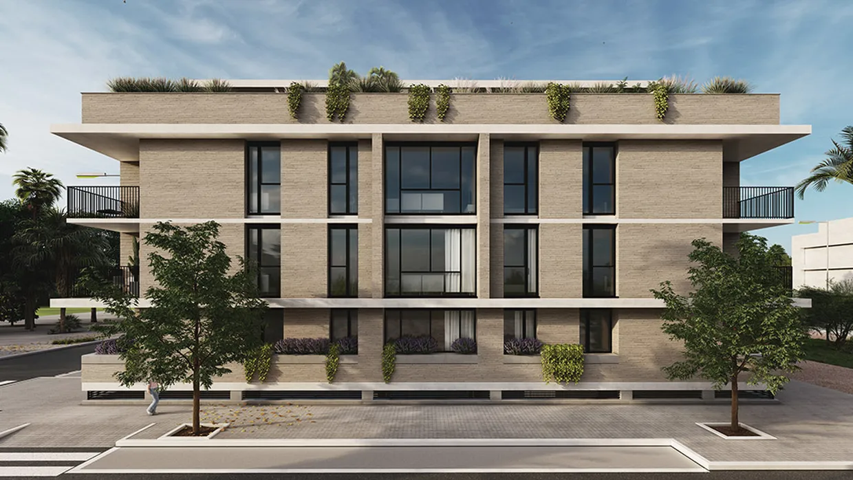 Fachada del edificio de Terras Canet con balcones y jardineras